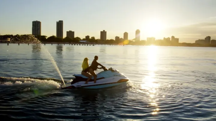Jet Ski Chicago rider on Lake Michigan in warm summer light.