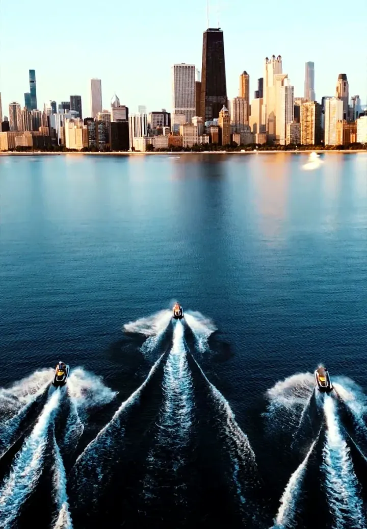 Three jet skis riding together on Lake Michigan.